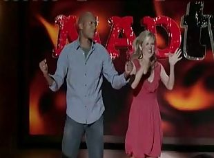 Live TV show with a black dude and a blonde with jiggling tits